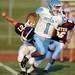 Skyline senior Jordan Woods runs the put return in for a touch down during the first quarter against Dexter at Dexter on Friday night.